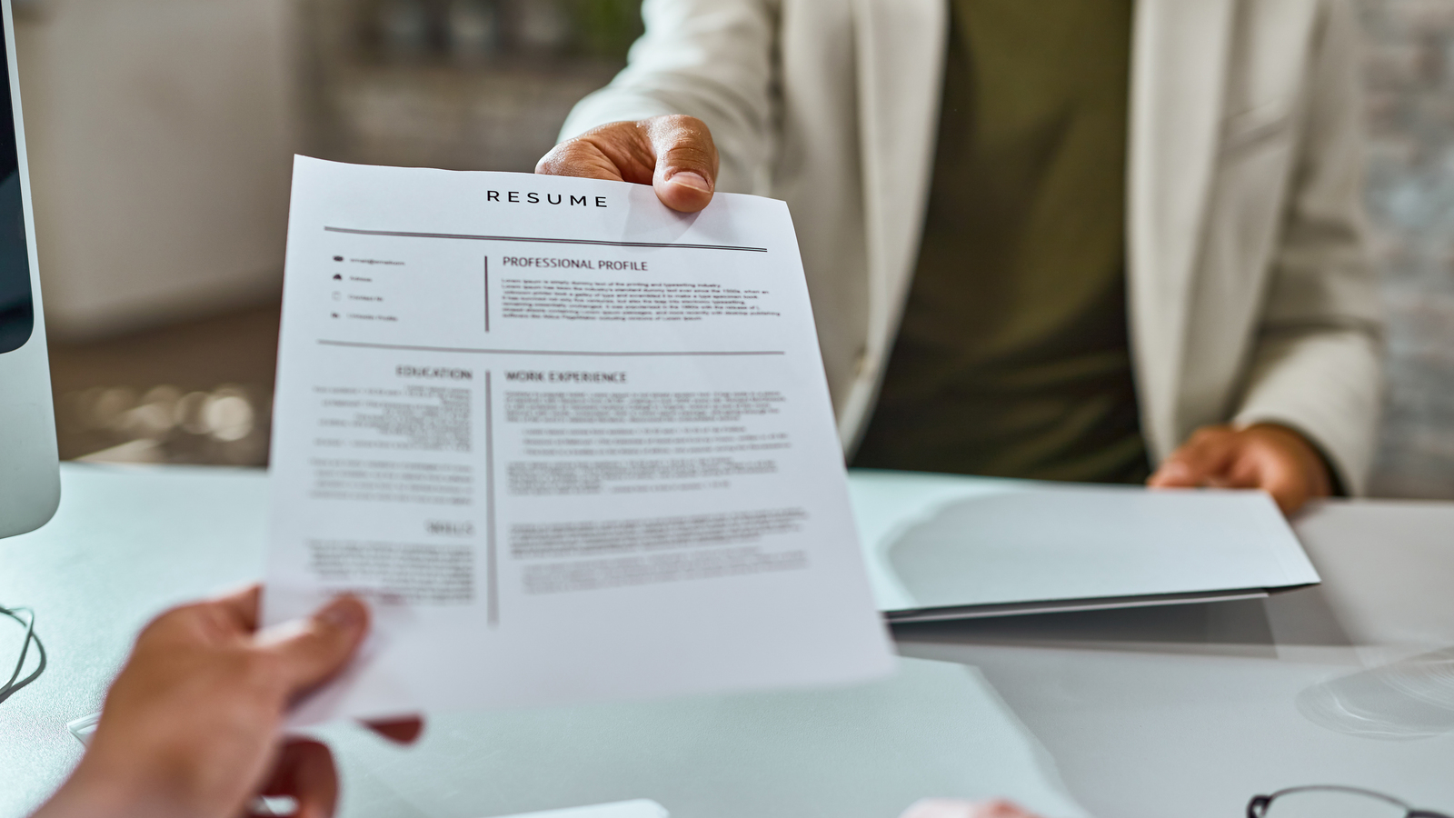 Closeup Job Applicant Giving His Resume During Job Interview Office